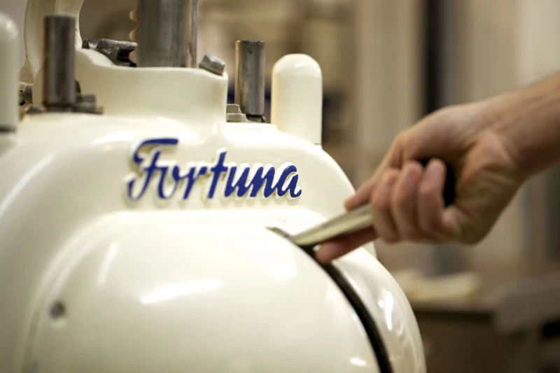 Historic bread roll press and traditional baking equipment